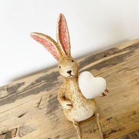 Shelf sitting rabbit with white heart