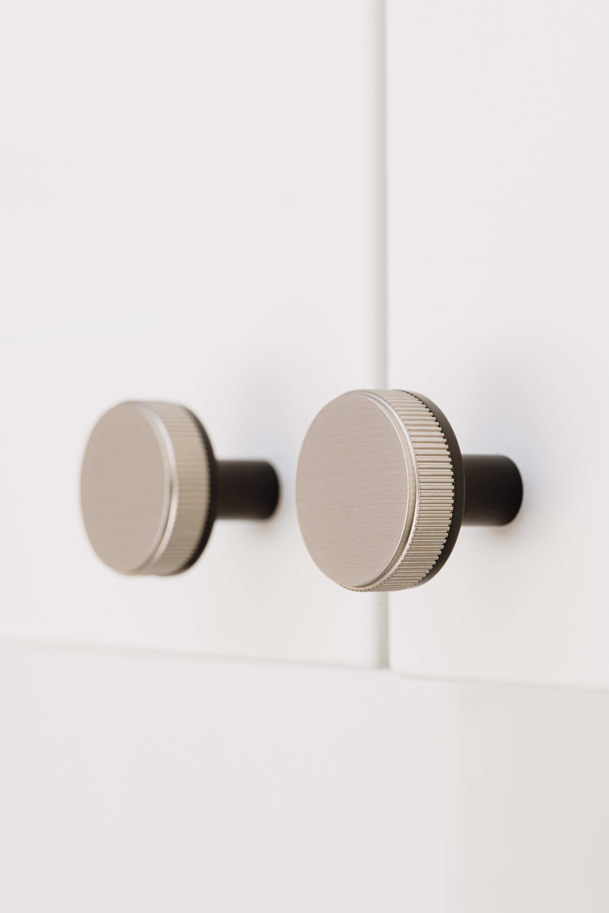 Brass Linear Door Knobs in Black and Silver