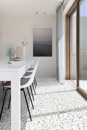 Contemporary dining room featuring a light aesthetic with Fiastra 46630 terrazzo floor from Moduleo