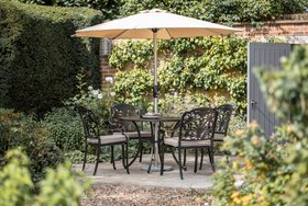 Bramblecrest Venice 100cm Round Table with 4x Stacking Armchairs, Parasol & Base – Bronze