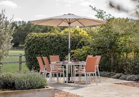Bramblecrest Sofia 165 x 95cm Rectangle Table with 6 Deluxe Armchairs, Parasol & Base - Apricot