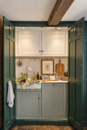Hidden Kitchen with Brass Hardware