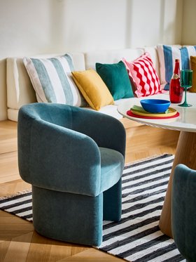 Dwell Terzo Dining Table in Gloss White and Oak, available exclusively at DFS, Dwell Eisha Dining Chair in Blue, available exclusively at DFS