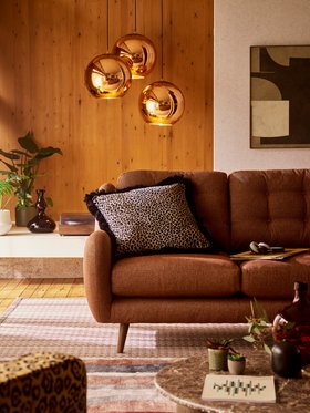 French Connection New Camden Left Hand Facing Arm Open End Corner Sofa in Camden Weave Spice, available exclusively at DFS, DFS Wylde Scatter Cushion in Ombre Mink, Dwell Eos Coffee Table in Smoke Oak, available exclusively at DFS, DFS Wylde Leopard Accen