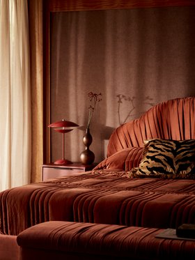 French Connection Belgravia King Bedframe in Rust, available exclusively at DFS, French Connection Belgravia Ottoman Box in Rust, available exclusively at DFS, DFS Hanley Set of 2 Bedside Tables in Burgundy, Loha Dining Chair in Latte, available exclusive