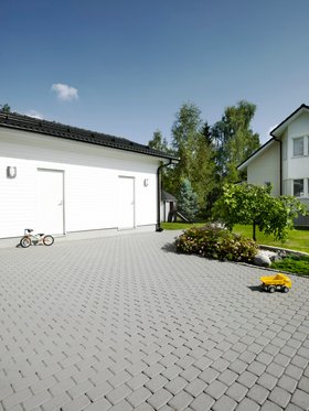 Driveway patio treated with patio paving stain