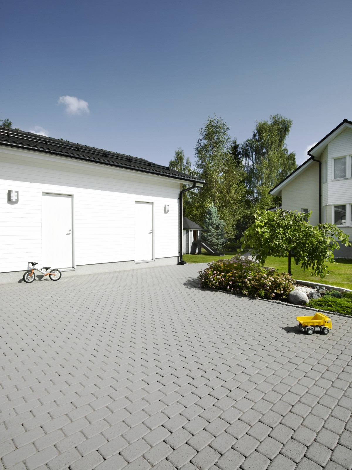 Driveway patio treated with patio paving stain
