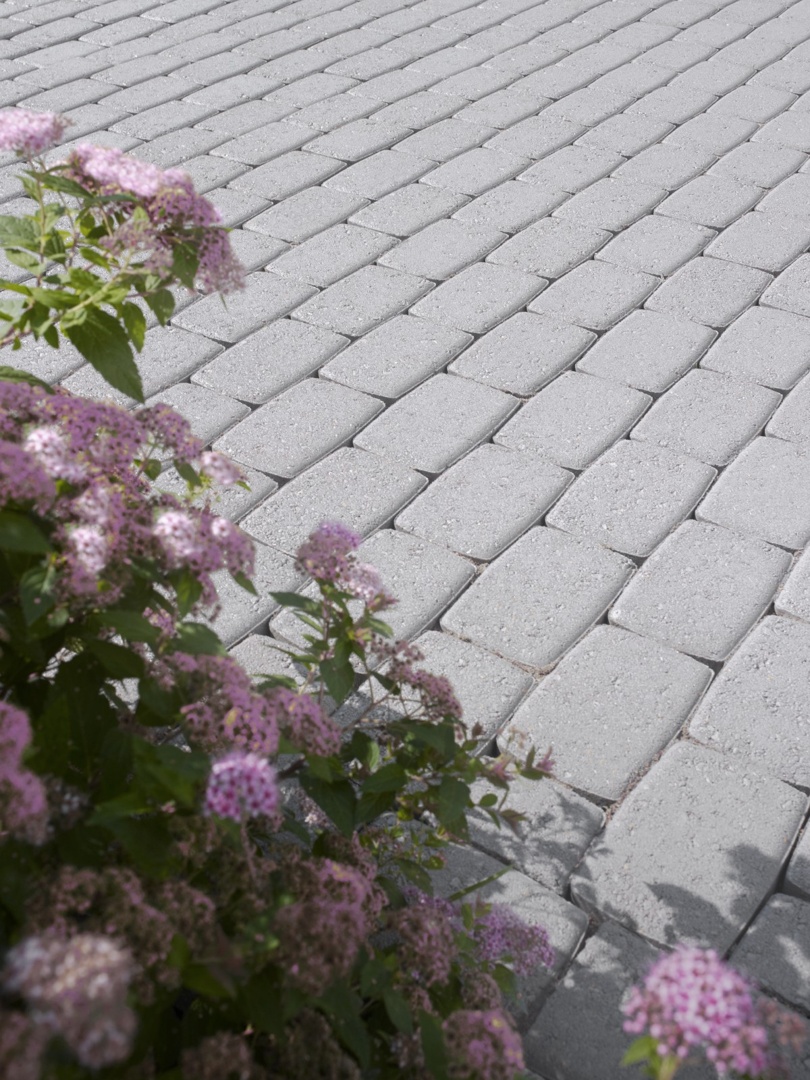 Grey Patio Paving Stain outside house with flowers