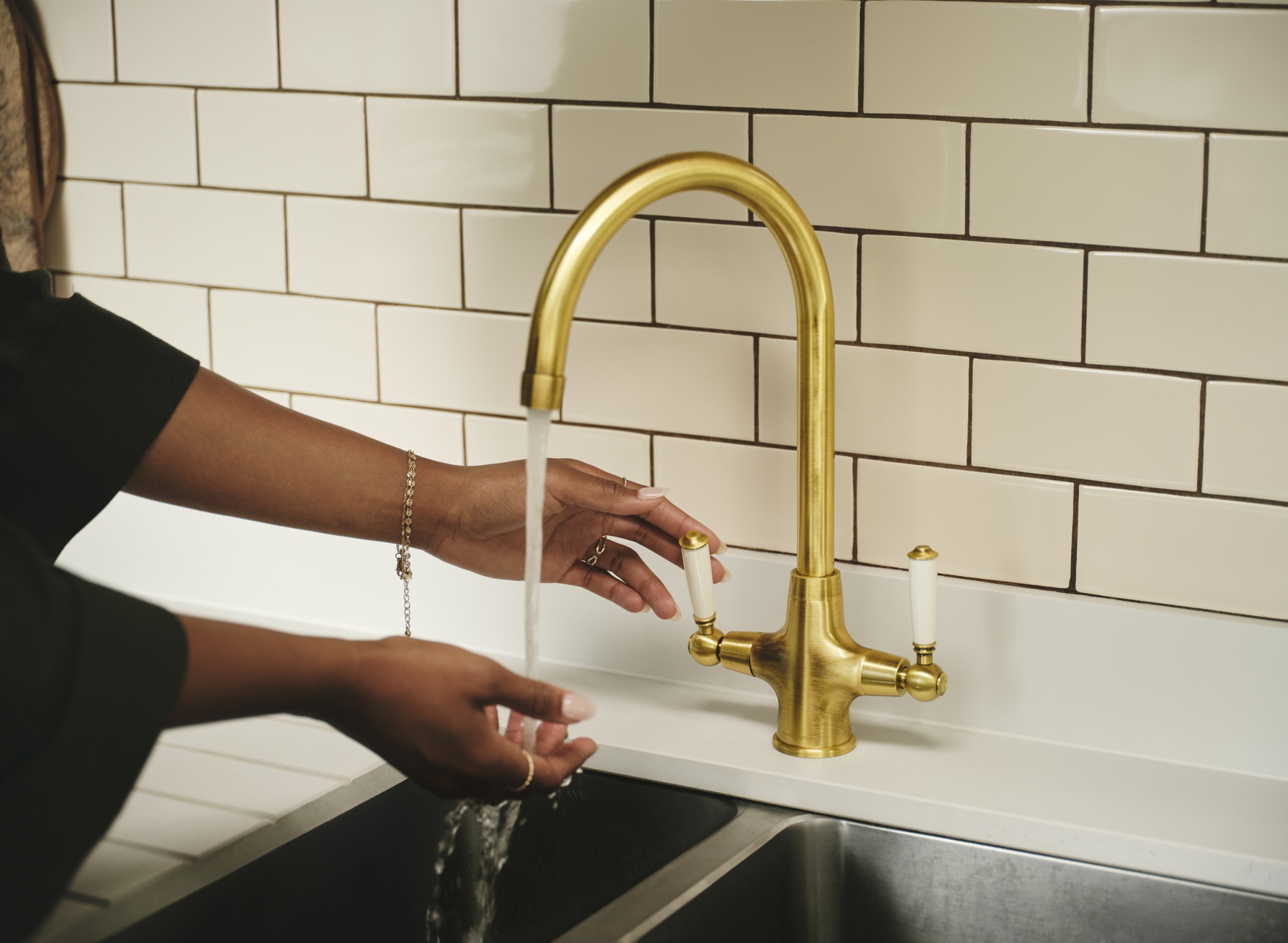AquaClassic dual lever tap in Antique Brass with white handles