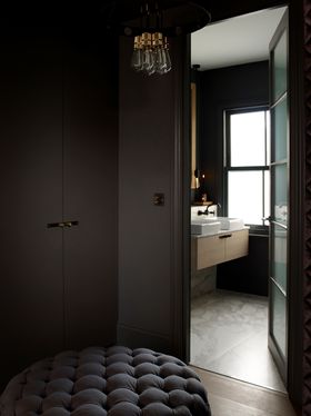 Buster + Punch, Cross Hero Light in Graphite with a Brass Finish from £1,094, Cross 2G Smoked Bronze Dimmer Switch with a Brass Finish £114, Cross Smoked Bronze Knob Plate with a Brass Finish from £79 (busterandpunch.com)