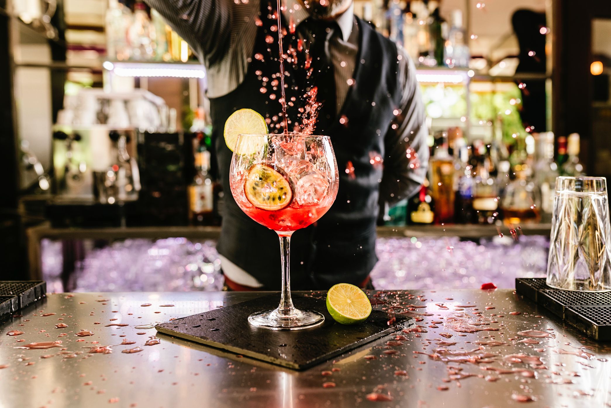 Bartender Pouring Cocktail From The Bottle Into The 2.png