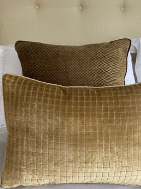 Warm gold velvet cushion