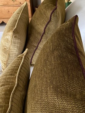 Warm gold velvet cushion