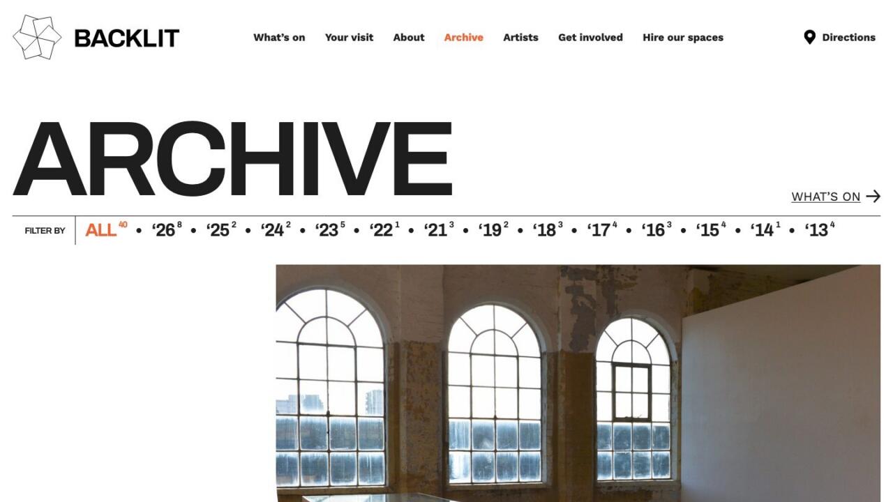 The Backlit archive page, with past exhibitions grouped by year and a filter running from 2013 onwards.