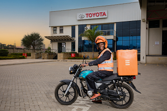 DELIVERY MOTORCYCLE OUTDOORS ON LOCATION PORTRAITS