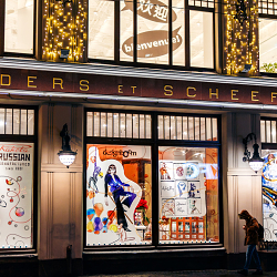 Christmas windows with fashion illustrations in luxury store.