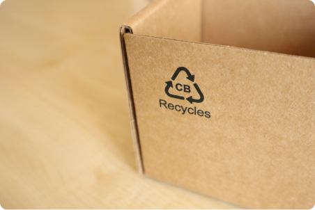 Recycle logo on cardboard box
