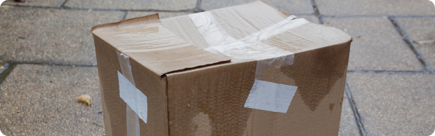 Wet cardboard box on pavement