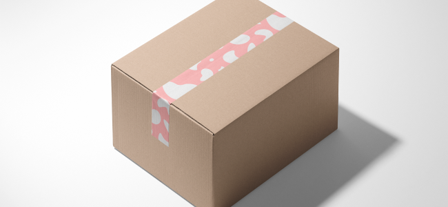 Pink printed paper tape on a cardboard box