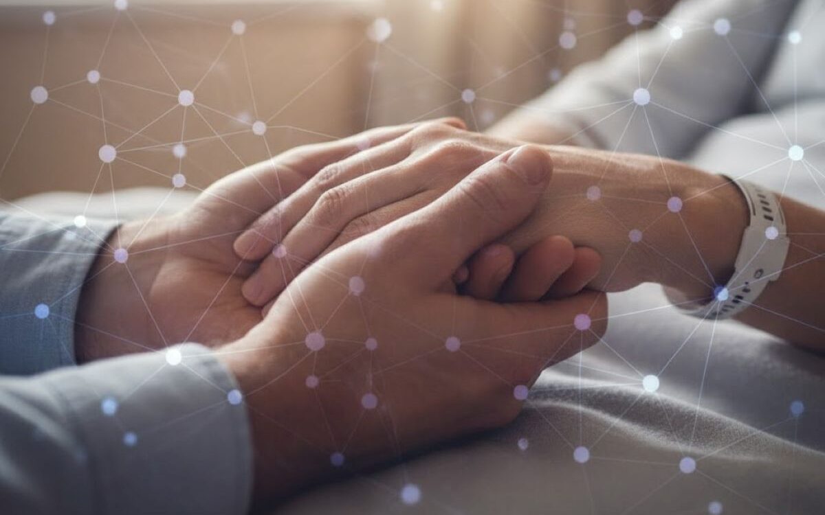 u27-MND-resized carer holding hands with partner who has Motor Neurone Disease