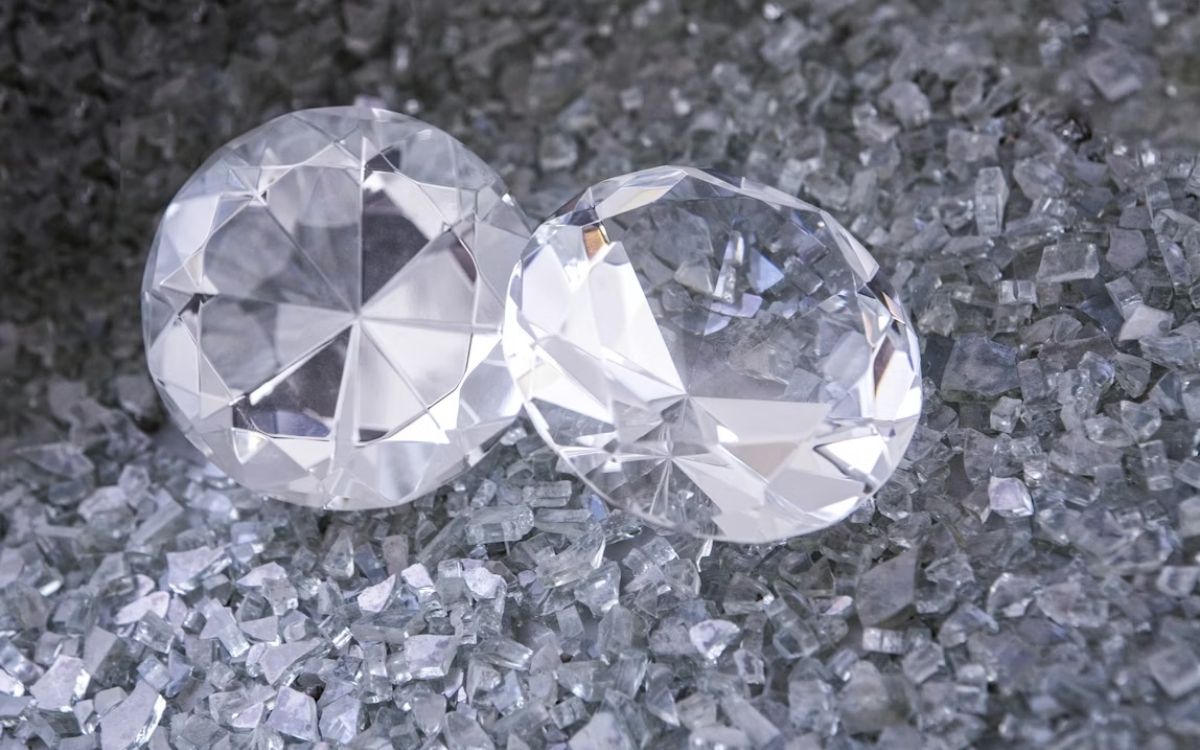 Featured-Image-1 Natural diamonds in healthcare research resting on crushed glass surface.