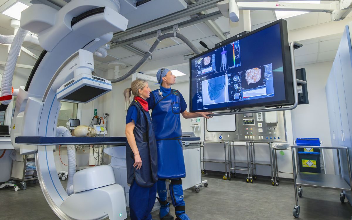 Canon Medical Forth Valley-95 1 Two clinicians working in interventional radiology NHS suite at Forth Valley Royal Hospital.