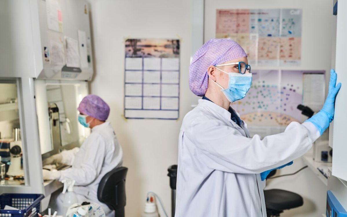 iPSC-derived therapies research — two scientists working in a regenerative medicine laboratory.