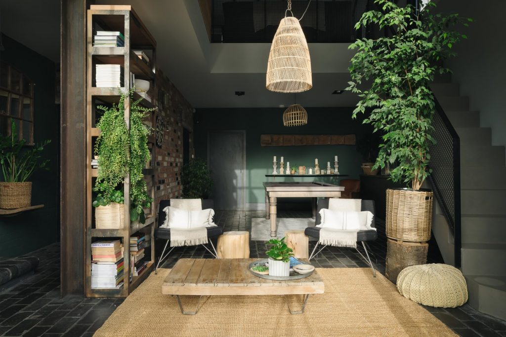 Living room with dark green walls and jute rug at a multi-backdrop location