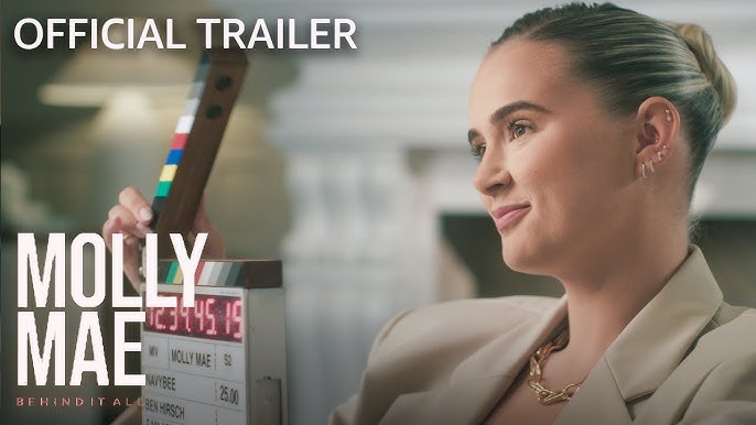 Thumbnail image for Molly-Mae: Behind It All Season 2 trailer. Molly's head and shoulders, fireplace in background.