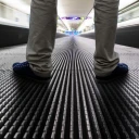 Man stood on travelator facing forwards