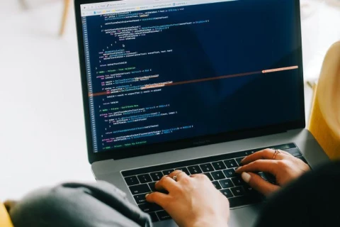 Female developer working on laptop