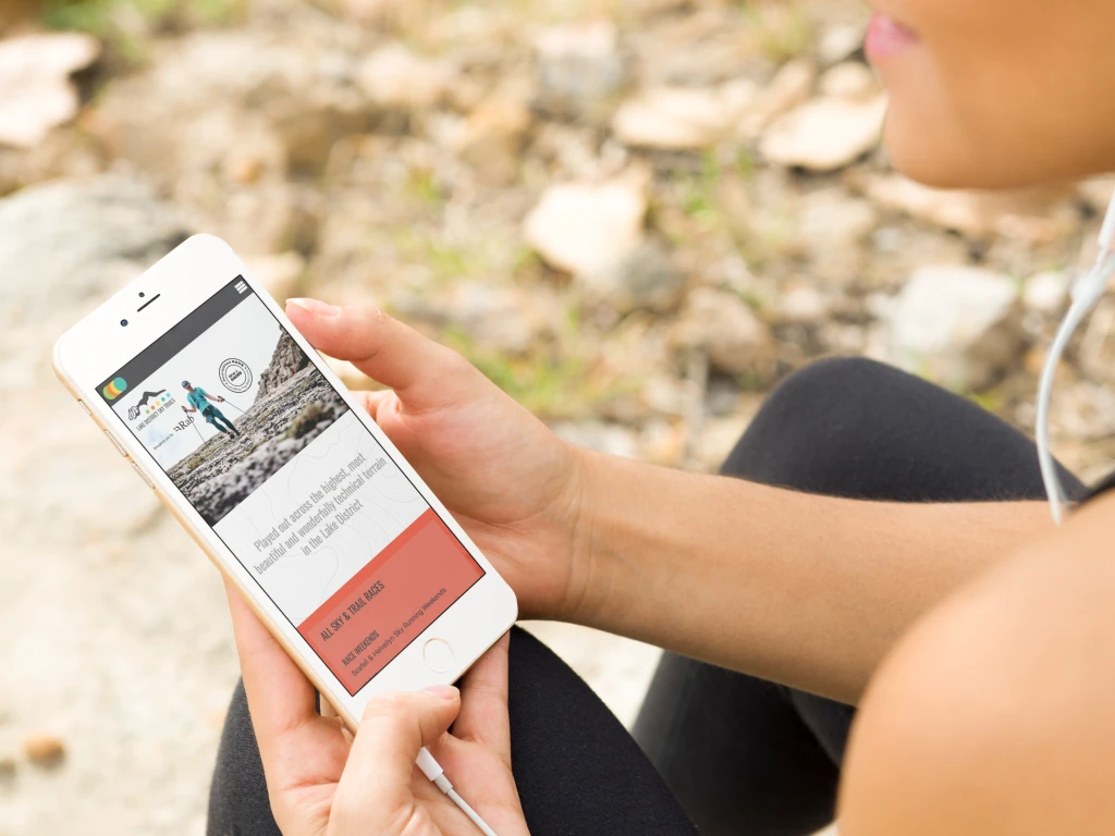 Athlete taking a break from running and looking up a website
