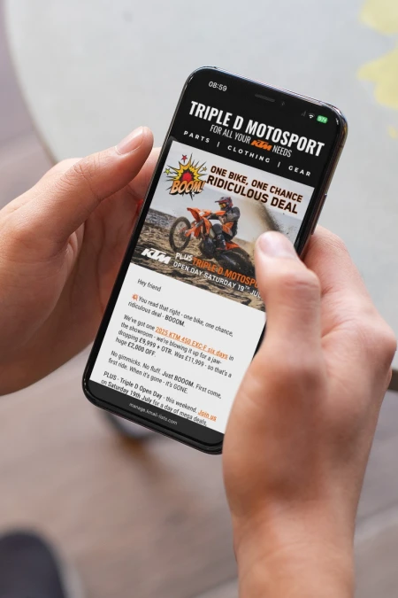 Man browsing email newsletter sent from Klaviyo for Triple D Motosport on a mobile device