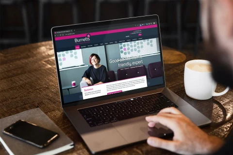 Burnetts website on laptop