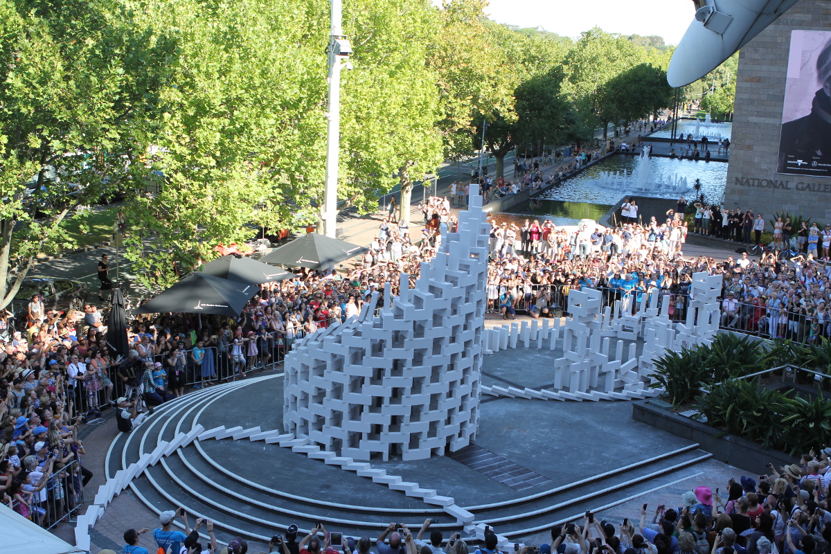 2016_08-Image-courtesy-of-Artsadmin-©-Kieran-Stewart-Dominoes-Station-House-Opera-Melbourne-2016 Tower of toppling breeze blocks displayed outside in Melbourne. A performance by Station House Opera.