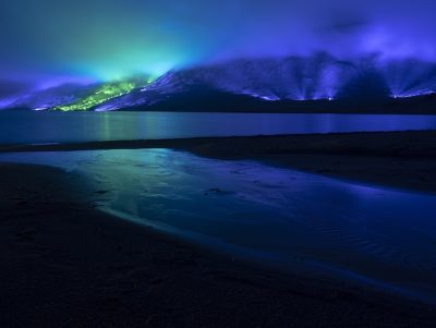 An emerald and blue light roof over the Connemara mountains valley