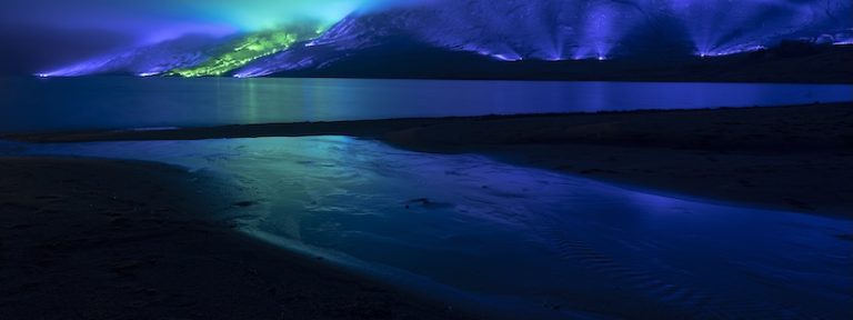 An emerald and blue light roof over the Connemara mountains valley