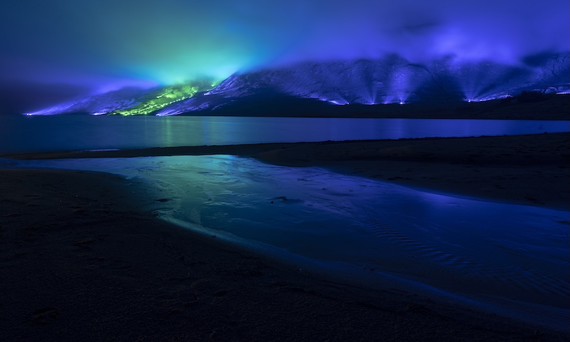 An emerald and blue light roof over the Connemara mountains valley