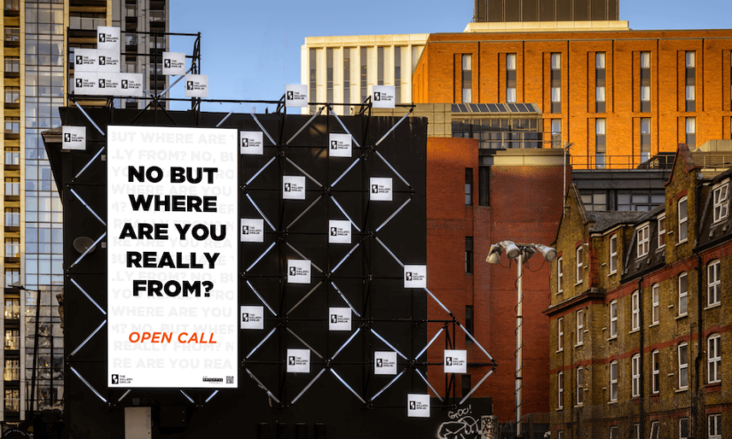 Landscape_resized A billboard displays the words: NO BUT WHERE ARE YOU REALLY FROM? OPEN CALL