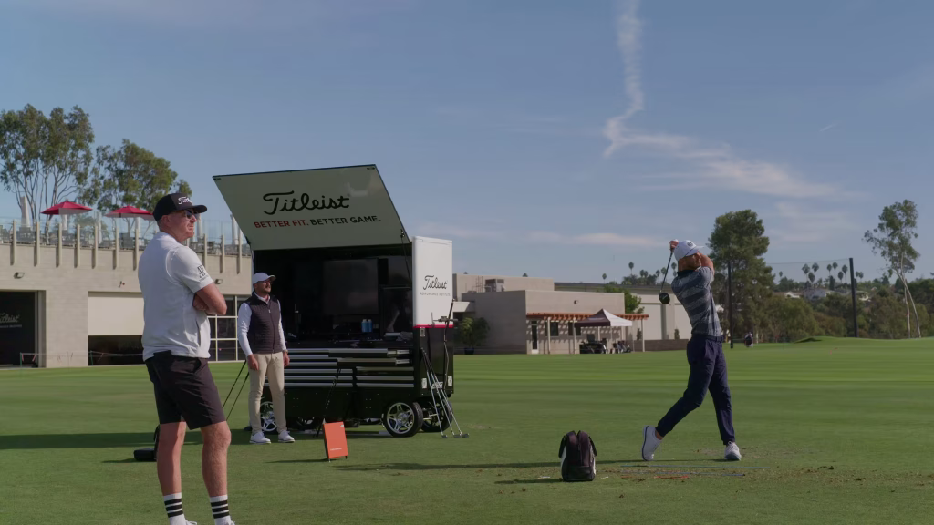 Golfer completing a full-swing assessment with a coach during a TPI session at a Golf School.