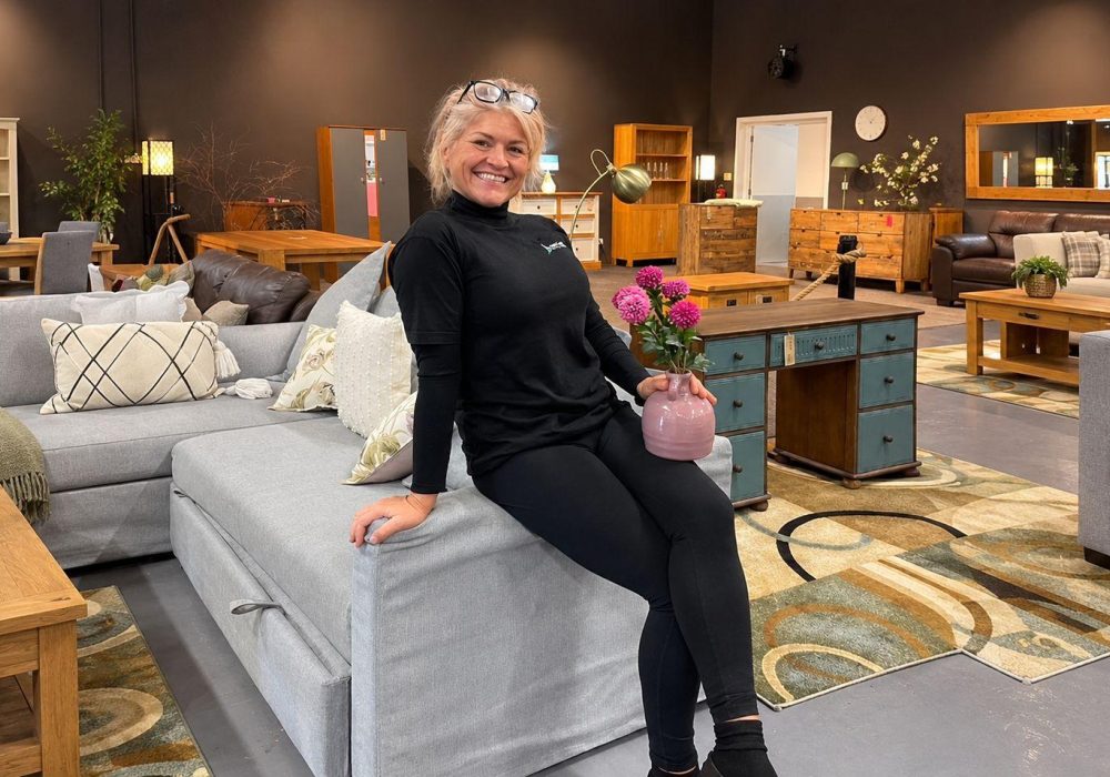 Warm Rustic Furniture Showroom with Smiling Woman