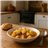 Stewed potatoes with artichokes in a homemade pot-lateral