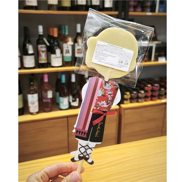 La traducción al alemán de "Piruleta fallero de chocolate 'Mario Padial'" es:

"Schokoladen-Lutscher 'Mario Padial'"-lateral