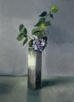 “Lilac flowers in tall vase”