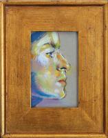 Profile of a woman in gold frame