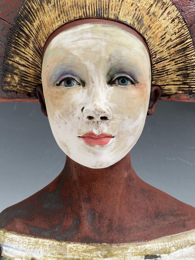 Bust with red fan hat