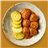 Albóndigas caseras en salsa de tomate con patatas al horno