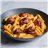 Penne rigate al romescu con longaniza catalana