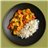 Pollo de corral al curry amarillo con verduras y arroz jazmín
