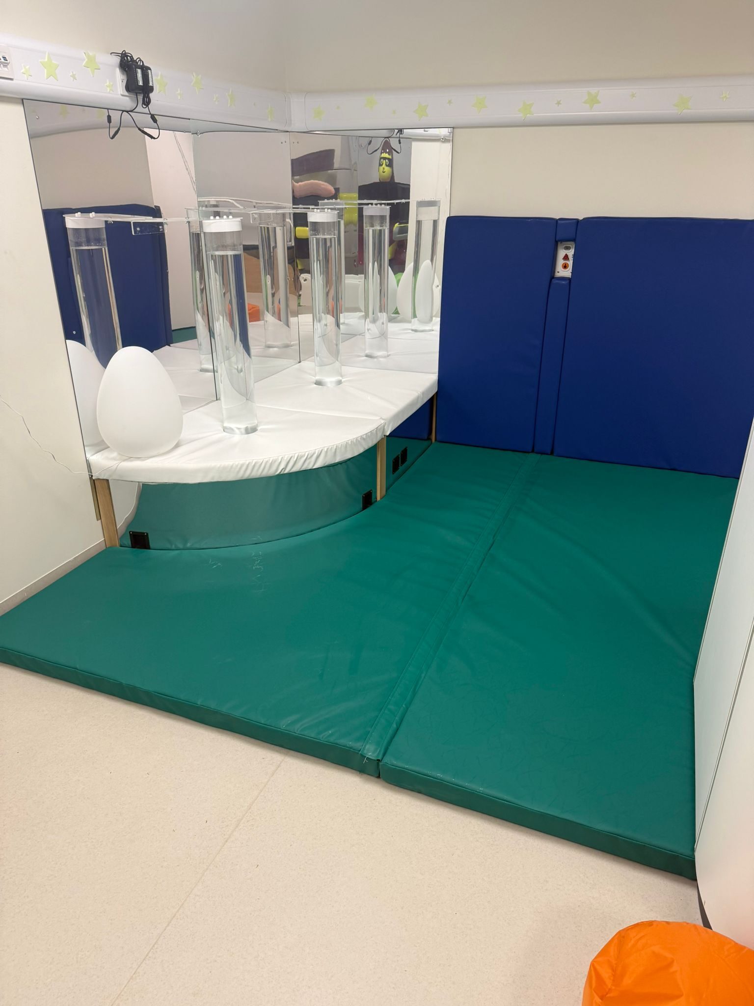 Sensory corner with hurricane tubes, mirrors and padding